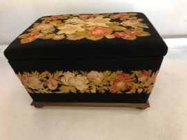 A tapestry upholstered and mahogany ottoman