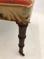 A needlework and mahogany stool