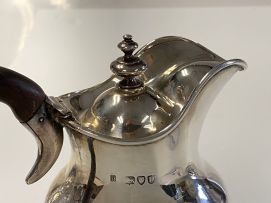 A Victorian silver hot water jug, Holland, Aldwinckle & Slater, London, 1895