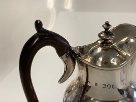 A Victorian silver hot water jug, Holland, Aldwinckle & Slater, London, 1895