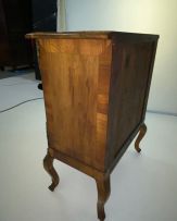 A French parquetry kingwood and walnut-veneered chest of drawers, late 19th century