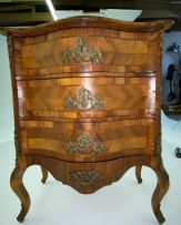 A French parquetry kingwood and walnut-veneered chest of drawers, late 19th century