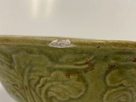 A Chinese provincial carved celadon-glazed bowl, 17th century
