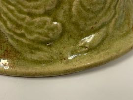 A Chinese provincial carved celadon-glazed bowl, 17th century