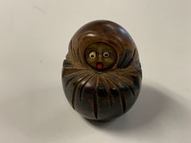 A Japanese wood carving of a Daruma, Meiji period, 1868-1912