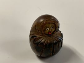 A Japanese wood carving of a Daruma, Meiji period, 1868-1912