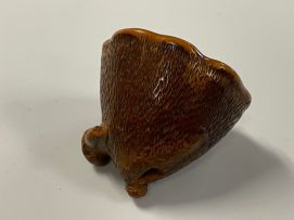 A Japanese wood netsuke of a lily pod, Meiji period, 1868-1912