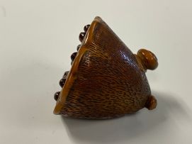 A Japanese wood netsuke of a lily pod, Meiji period, 1868-1912