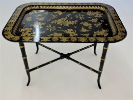A black lacquered and gilt tray-on-stand