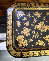 A black lacquered and gilt tray-on-stand
