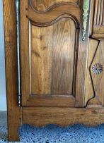 A French oak and cherrywood armoire, late 18th/early 19th century