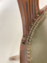 An Edwardian mahogany and inlaid armchair