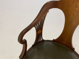 An Edwardian mahogany and inlaid armchair