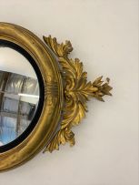 A Regency style convex giltwood mirror, 19th century
