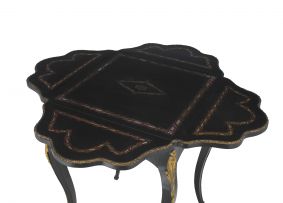 An ebonized, brass and mother-of-pearl inlaid gilt-metal mounted occasional table, late 19th century