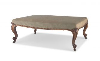 A Victorian rosewood and upholstered ottoman