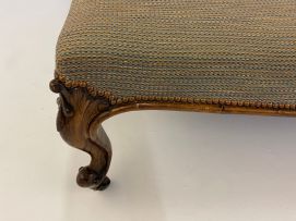 A Victorian rosewood and upholstered ottoman