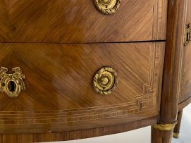 A Louis XVI style demi-lune parquetry and gilt-metal-mounted cabinet