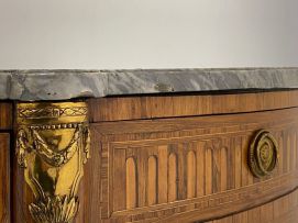 A Louis XVI style demi-lune parquetry and gilt-metal-mounted cabinet