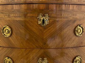 A Louis XVI style demi-lune parquetry and gilt-metal-mounted cabinet