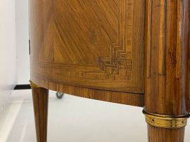 A Louis XVI style demi-lune parquetry and gilt-metal-mounted cabinet