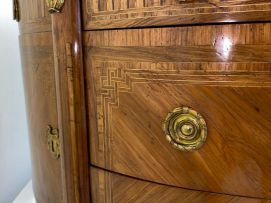 A Louis XVI style demi-lune parquetry and gilt-metal-mounted cabinet