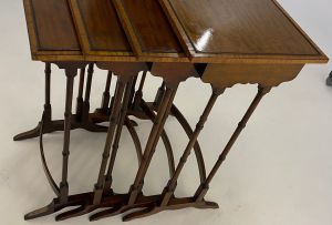 A nest of four George III style mahogany quartetto tables