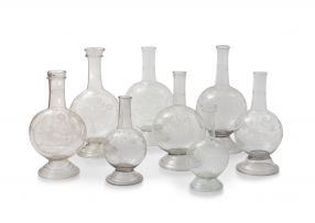 A collection of eight German clear and engraved glass flasks, 19th century