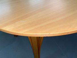 A laminated beech Ellipse occasional table designed in 1969 by Piet Hein for Fritz Hansen