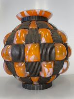 An Art Deco Daum Majorelle blown-out glass and wrought-iron metal-mounted vase, circa 1930