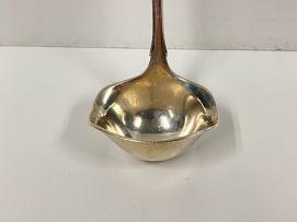 A Georg Jensen 'Lily of the Valley' pattern silver sauce ladle, 1930-1933