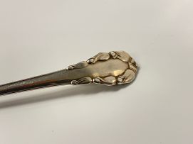 A Georg Jensen 'Lily of the Valley' pattern silver sauce ladle, 1930-1933