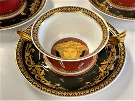A Rosenthal Versace red, gilt and black 'Medusa' pattern dinner service designed by Paul Wunderlich, 20th century