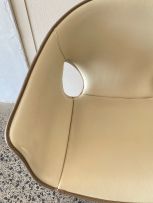 A Poltrona Frau Ginger saddle leather and stained ash armchair designed by Roberto Lazzeroni, 21st century