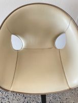 A Poltrona Frau Ginger saddle leather and stained ash armchair designed by Roberto Lazzeroni, 21st century