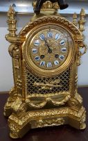 A gilt-metal and bronzed clock garniture, late 19th century