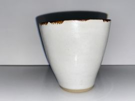 Lucie Rie (1902-1995) A pair of cream glazed stoneware coffee cups and saucers