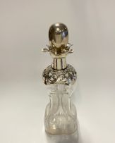 An Edward VII silver-mounted 'Glug Glug' glass decanter and stopper, Henry Clifford Davis, Birmingham, 1906 with Swedish date mark for 1907