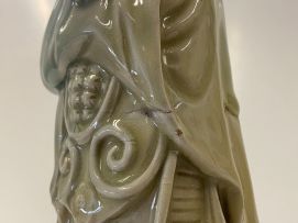 A Chinese celadon-glazed figure of Guang Gong