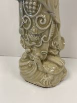 A Chinese celadon-glazed figure of Guang Gong