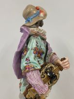 A pair of French porcelain figures of a hurdy-gurdy player and his companion, Paris, Jules Viallate, late 19th century