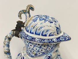 A large faience blue and white pewter mounted Toby pitcher, possible Dutch, 19th century