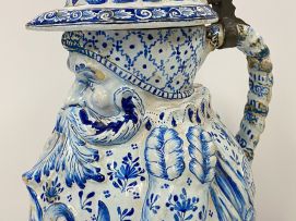 A large faience blue and white pewter mounted Toby pitcher, possible Dutch, 19th century