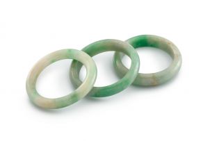 A pair of Chinese child's celadon jade bangles, Qing Dynasty, 19th century